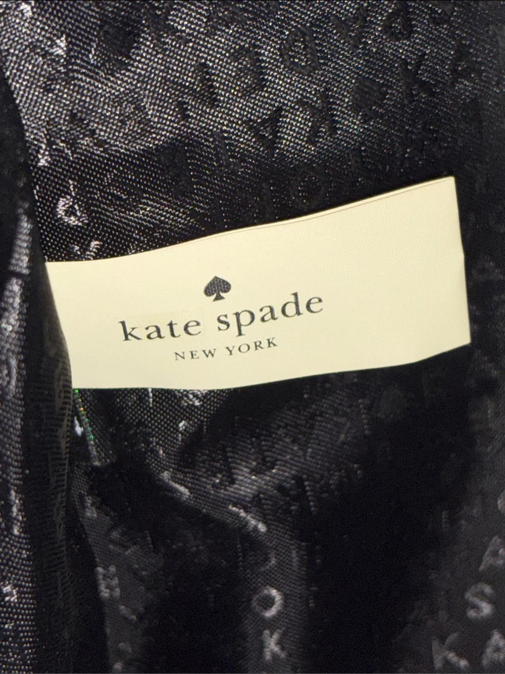 Kate Spade Salinas Tote sequins with a patent leather bow.